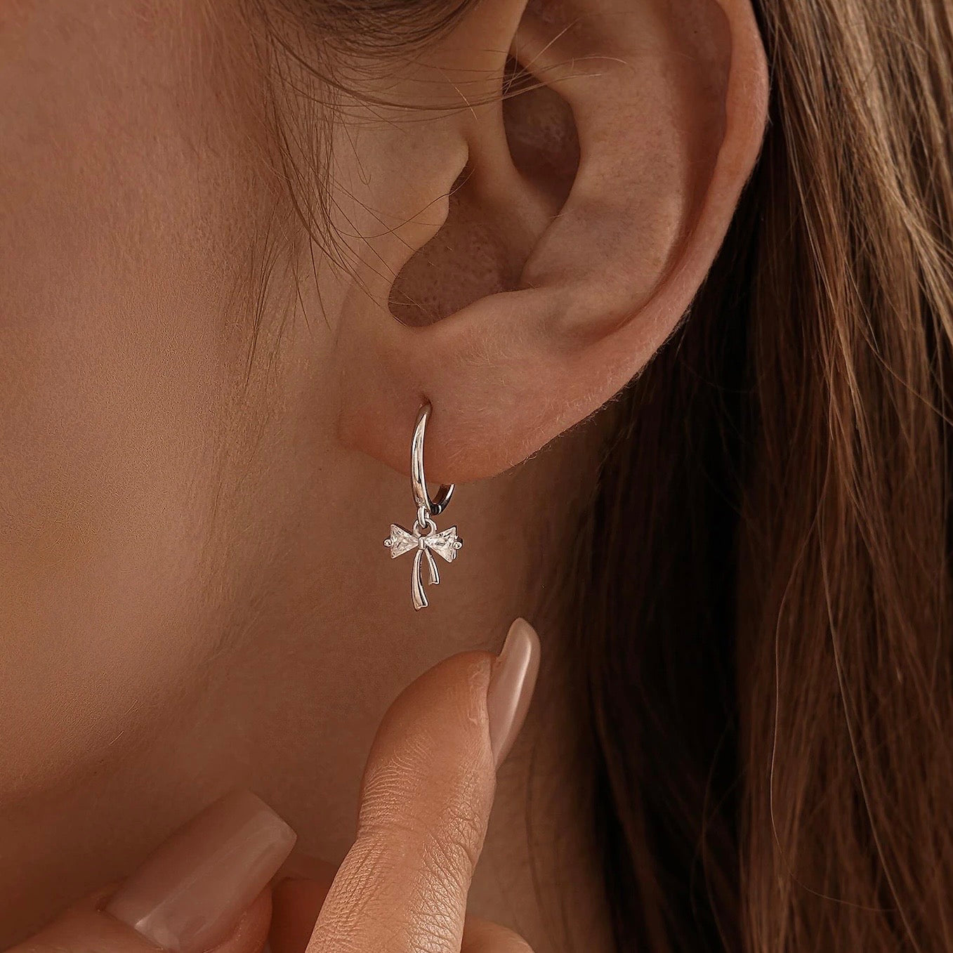 Ribbon Bow Huggie Earrings in Sterling Silver